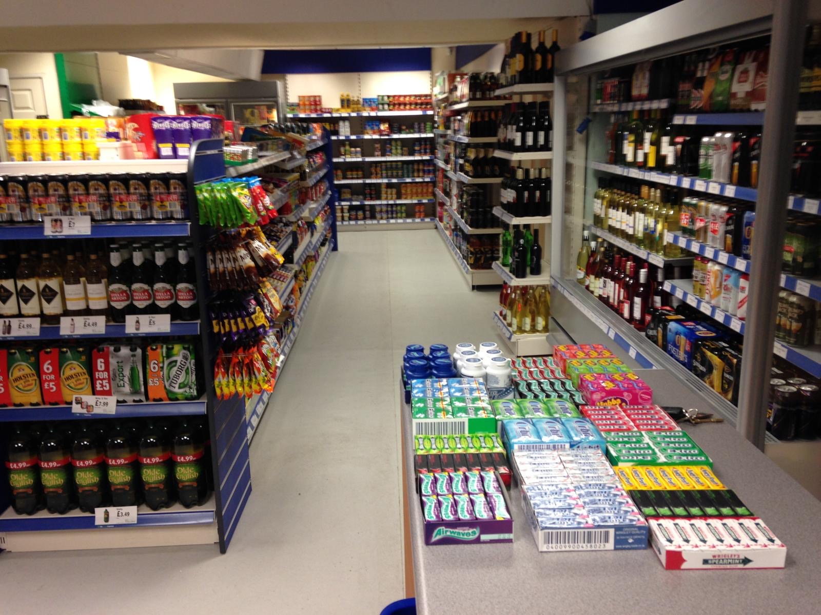 Inside Lifestyle Express, with grocery shelves, snacks and the drinks section.
